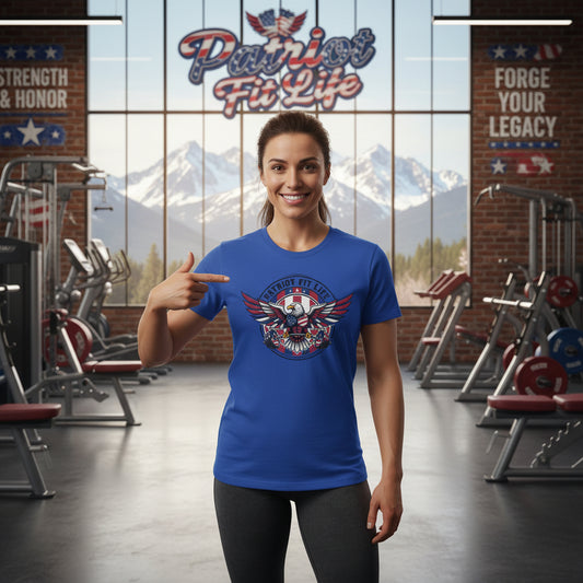 Woman wearing a blue t-shirt with a Patriot Fit Life logo in a gym setting.